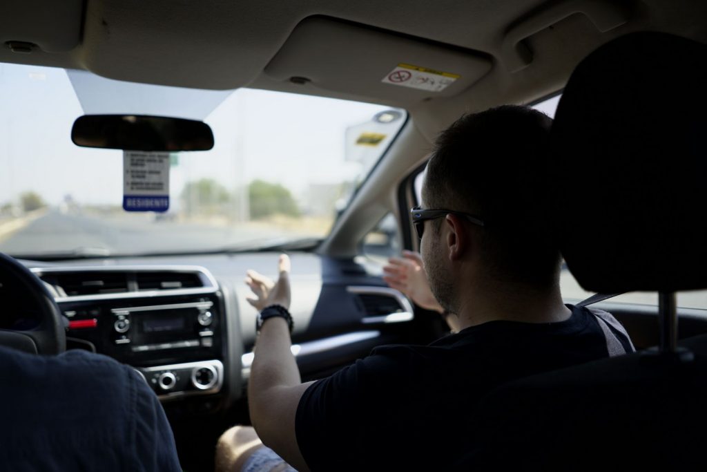 Driving instructor talking a pupil through a manoeuvre from the passenger seat