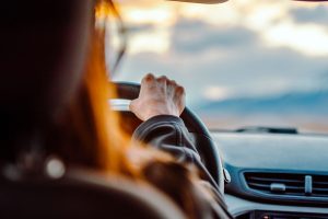 View through a car windscreen while driving into evening light