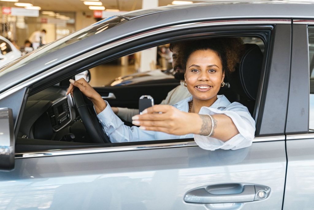 New driver holding her car keys after passing the practical driving test